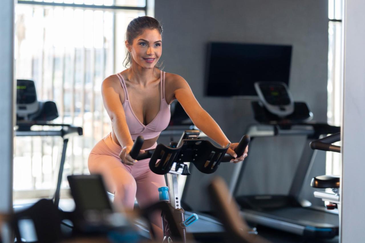 Hyatt Centric Jumeirah Dubai Exterior photo A woman on a stationary bicycle
